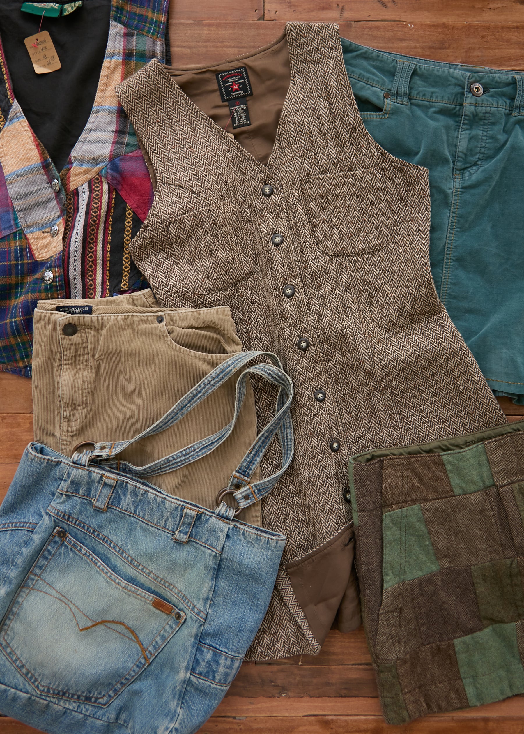American Eagle vintage garments: a tweed dress, khaki shorts, a patchwork vest, a patchwork skirt, and a denim pocket tote bag.