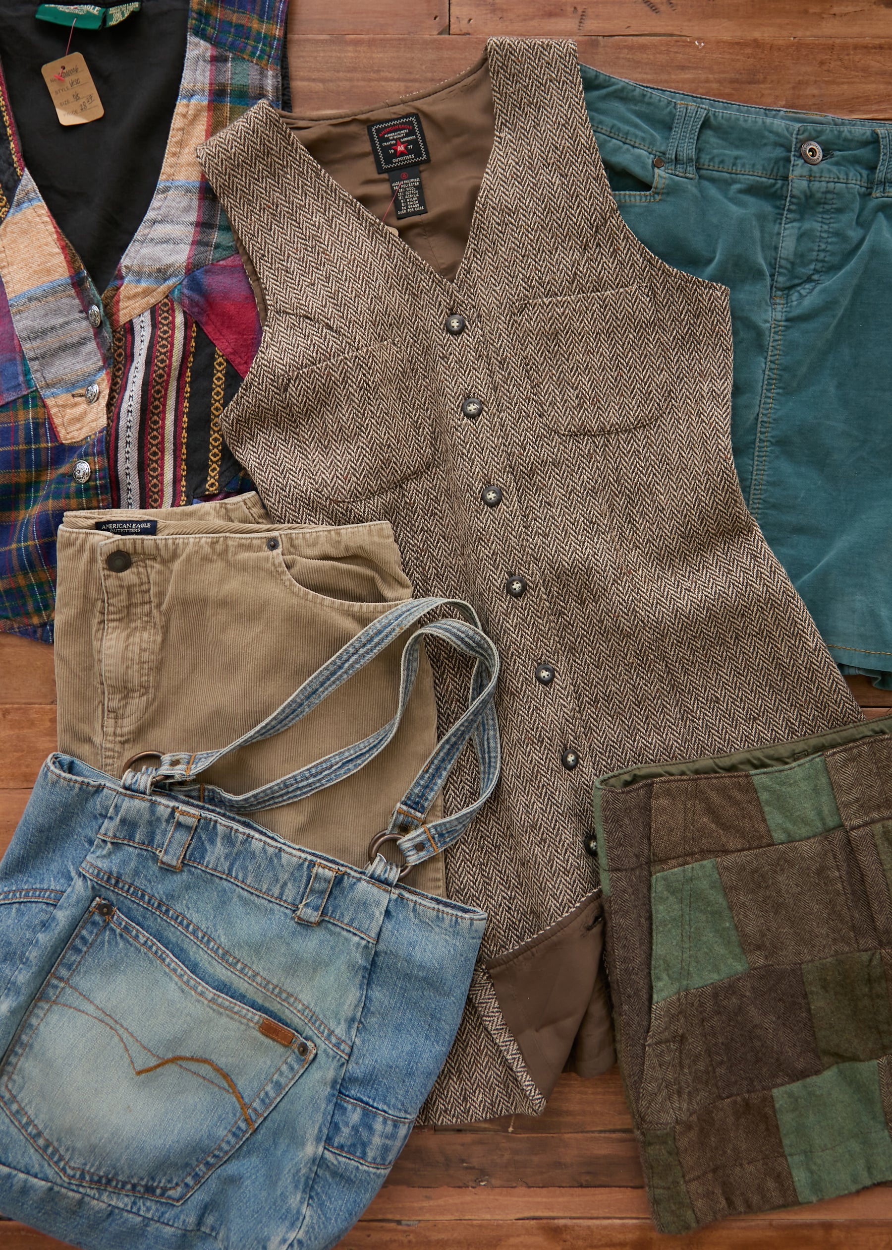 American Eagle vintage garments: a tweed dress, khaki shorts, a patchwork vest, a patchwork skirt, and a denim pocket tote bag. 